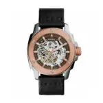 Fossil skeleton wristwatch with a rose-gold bezel, black leather strap, and visible inner gears