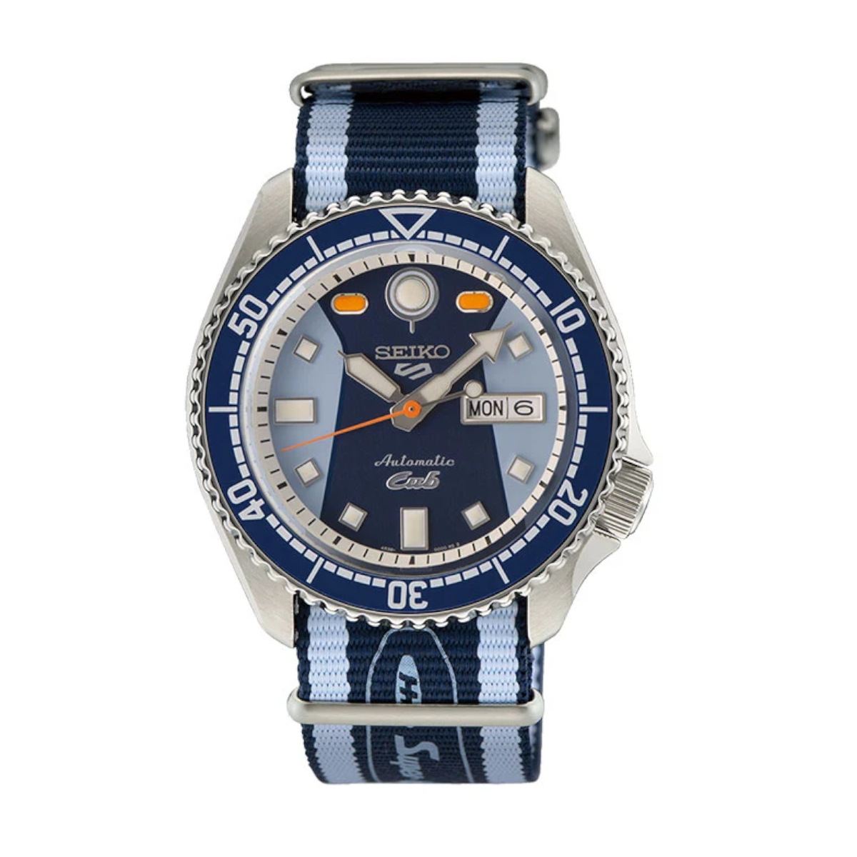 Seiko automatic dive watch with blue dial and striped blue NATO strap; day/date window visible on the right side
